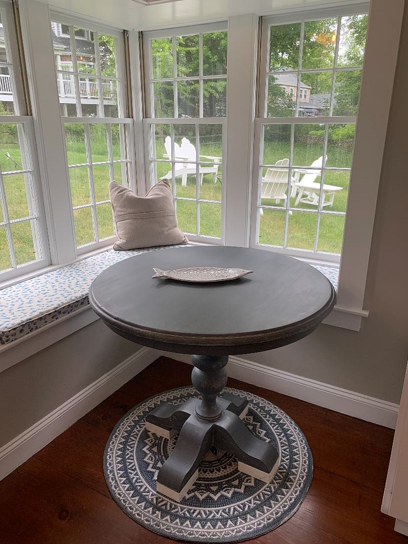 The breakfast nook looks out over the backyard.