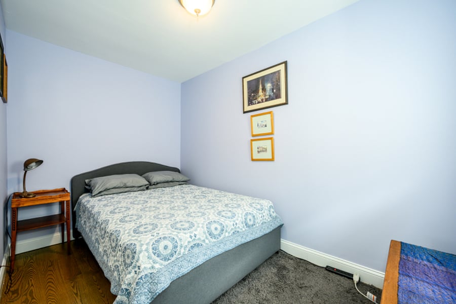 Queen size bed in first bedroom.