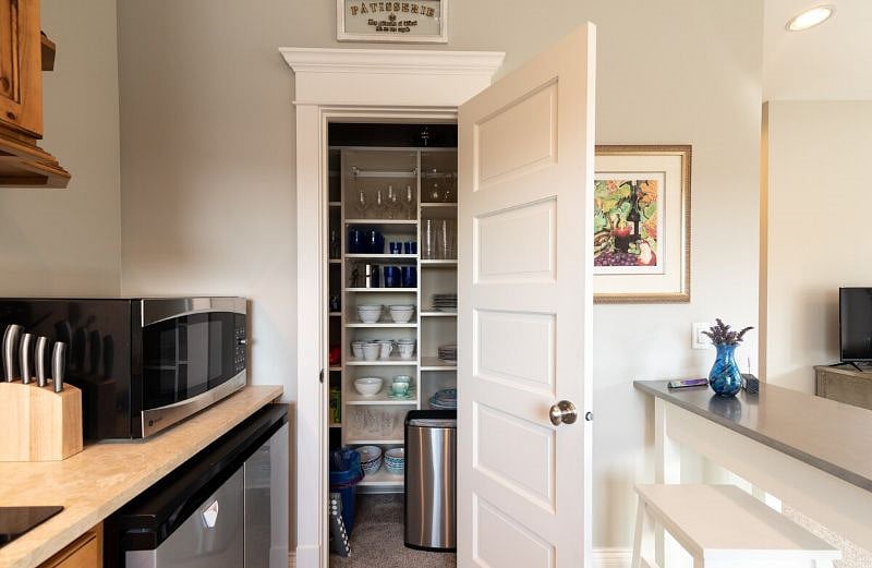Pantry with plenty of table and drink ware for extended stays