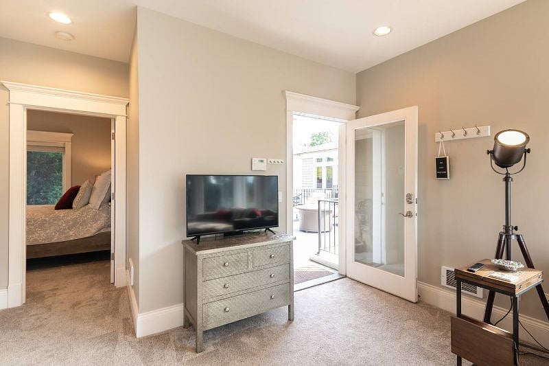 Living room with dresser storage and a wallmounted 50" Smart TV (updated from the one shown)