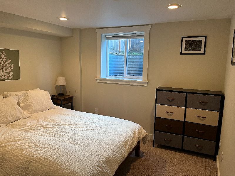 Bedroom with large closet and storage