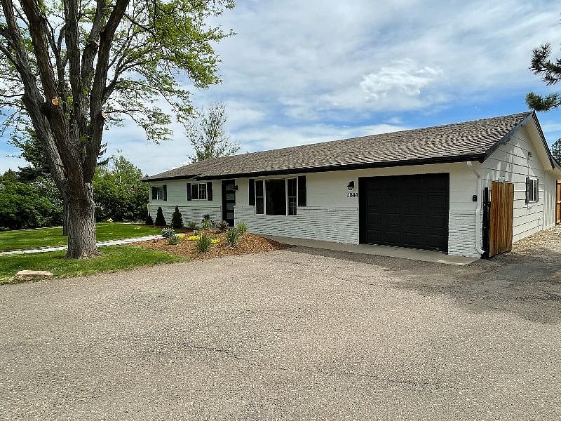Oversized garage with EV charger and 2 additional outside parking spots!