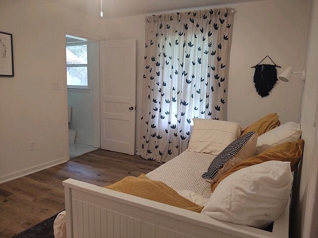 Twin bed coverts to a kind with bathroom connected. 