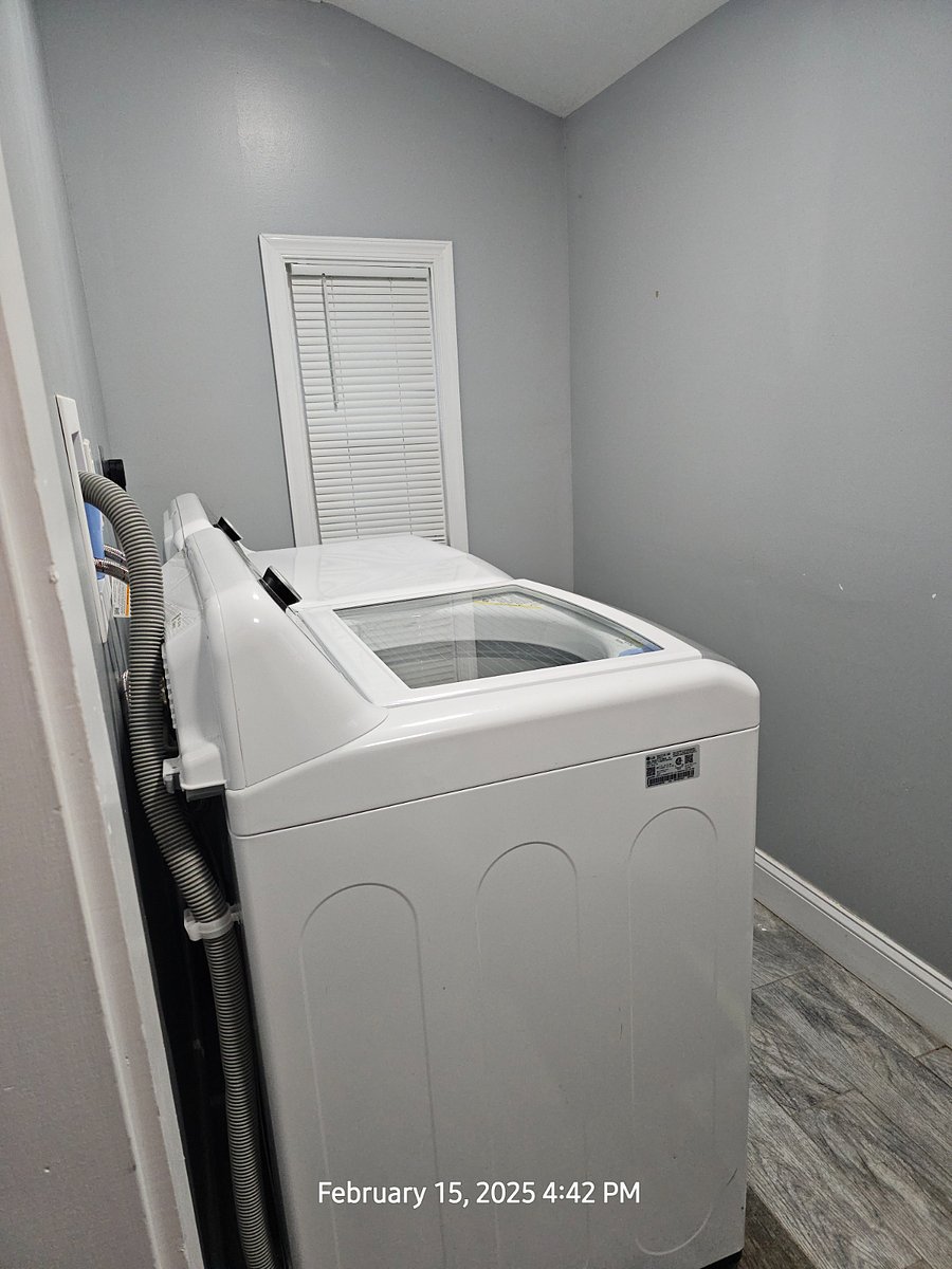 Clean laundry room on the premises.