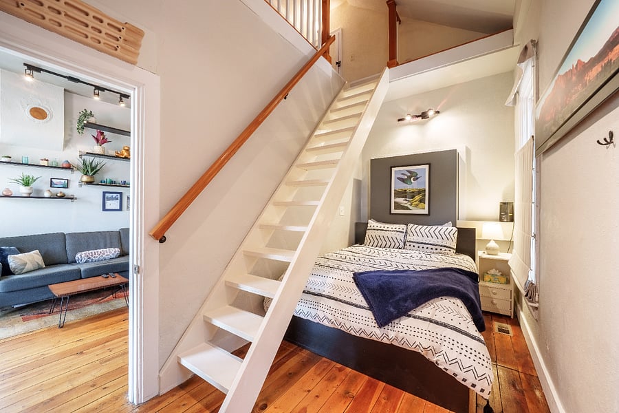 Master bedroom, stairs to the loft