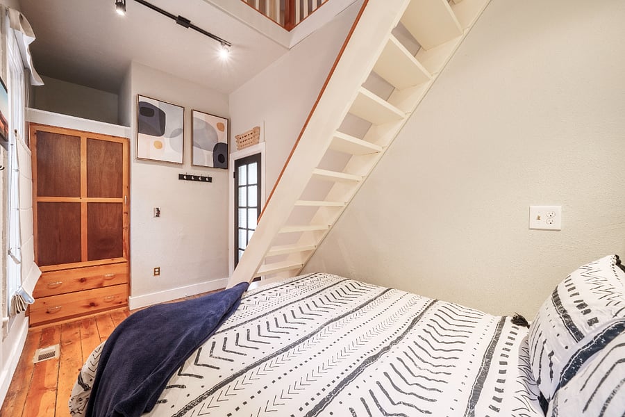Master bedroom, stairs to the loft