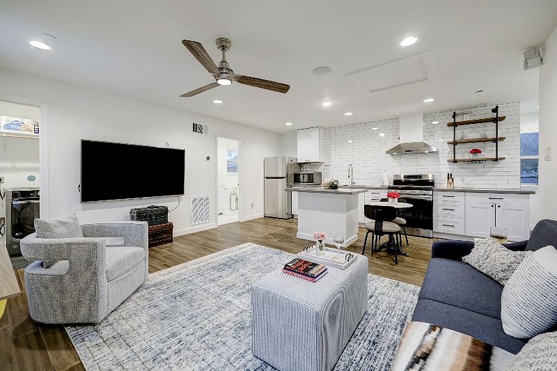 Another view of spacious and naturally bright living area.