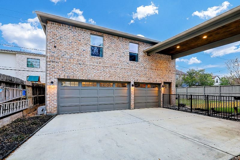 Apartment is a replica of the main house. Metal roof, foam insulated, rustic chicago-inspired brick. Back yard with plenty of grassy area. Garage is EV ready for one small vehicle with quality back up camera.