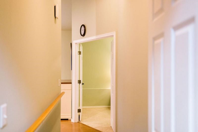 Looking to bedroom from laundry room. Pantry tucked behind door