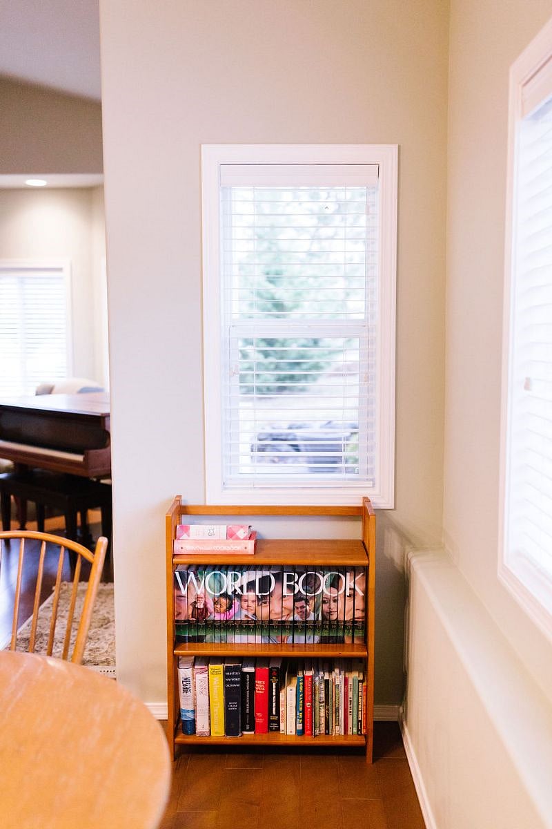 Cookbooks and book collection in dining/living space