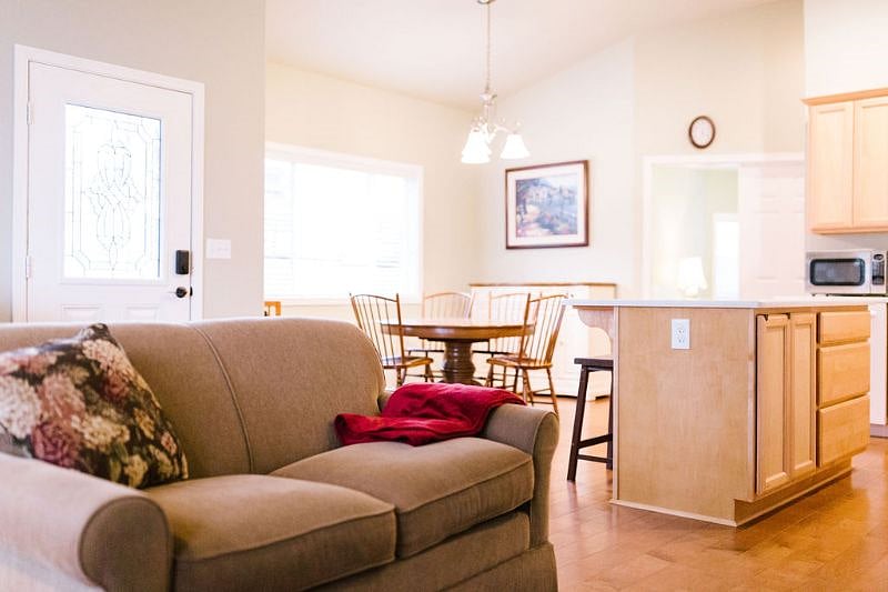 Living room looking into dining and kitchen space