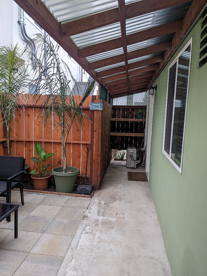 Entry is through private patio from the alley.
