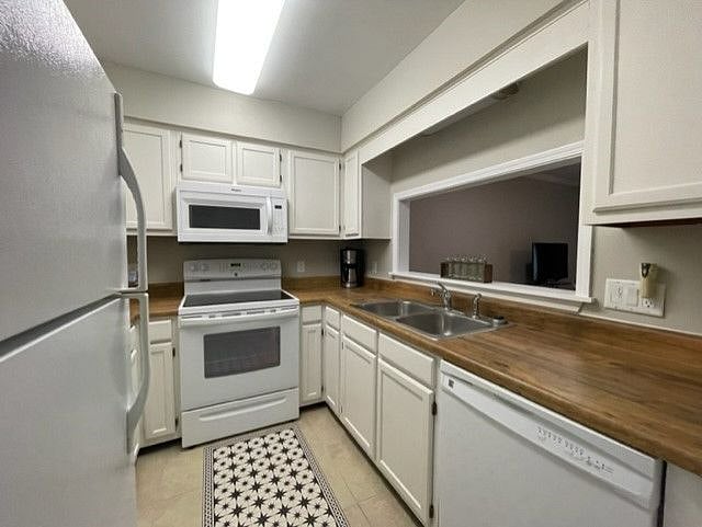 Kitchen with all kitchen items included (dishes, glassware, silverware, cooking utensils and pots/pans