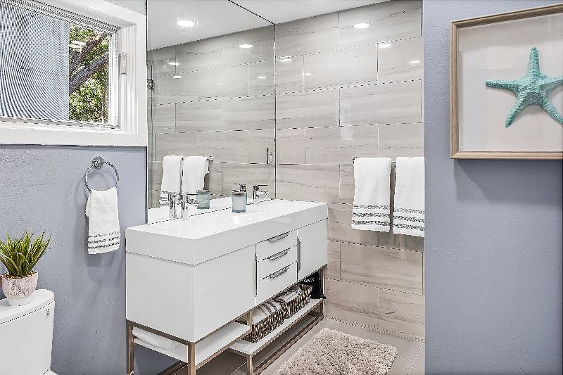 Master bathroom with double vanity and walk-in shower