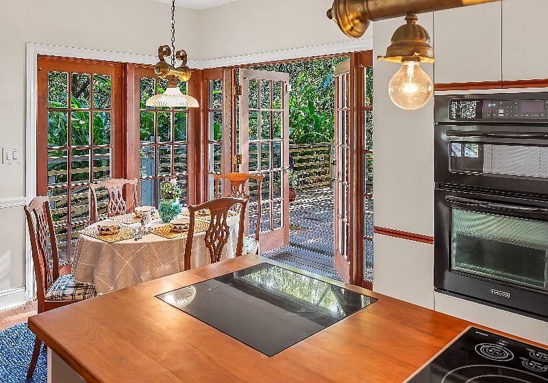 Eat -in kitchen area leading to back deck