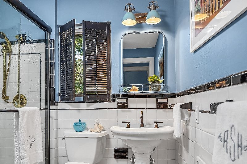 Downstairs full bathroom with walk-in shower, adjacent to downstairs bedroom