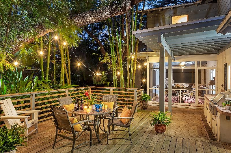 Back deck with outdoor kitchen, at night