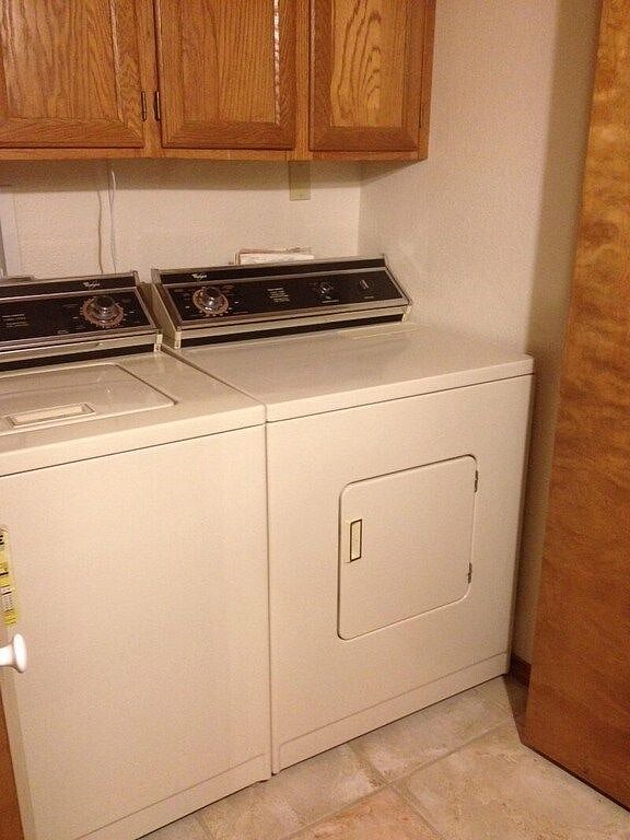 Washer and Dryer in hall closet area.