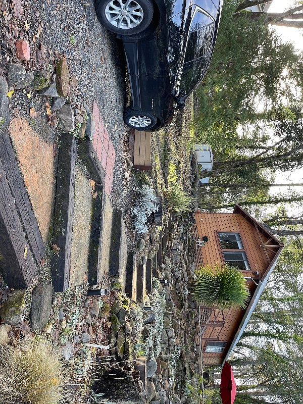 Your assigned parking is right by the stone steps leading to the cottage. An iron hand rail is being designed and up soon.