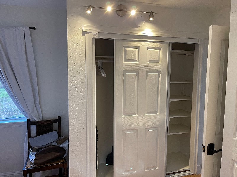 This is the first hanging closet which is good for shoes and tall things. New white black -out curtains help make a dark room for those who need to sleep late.  