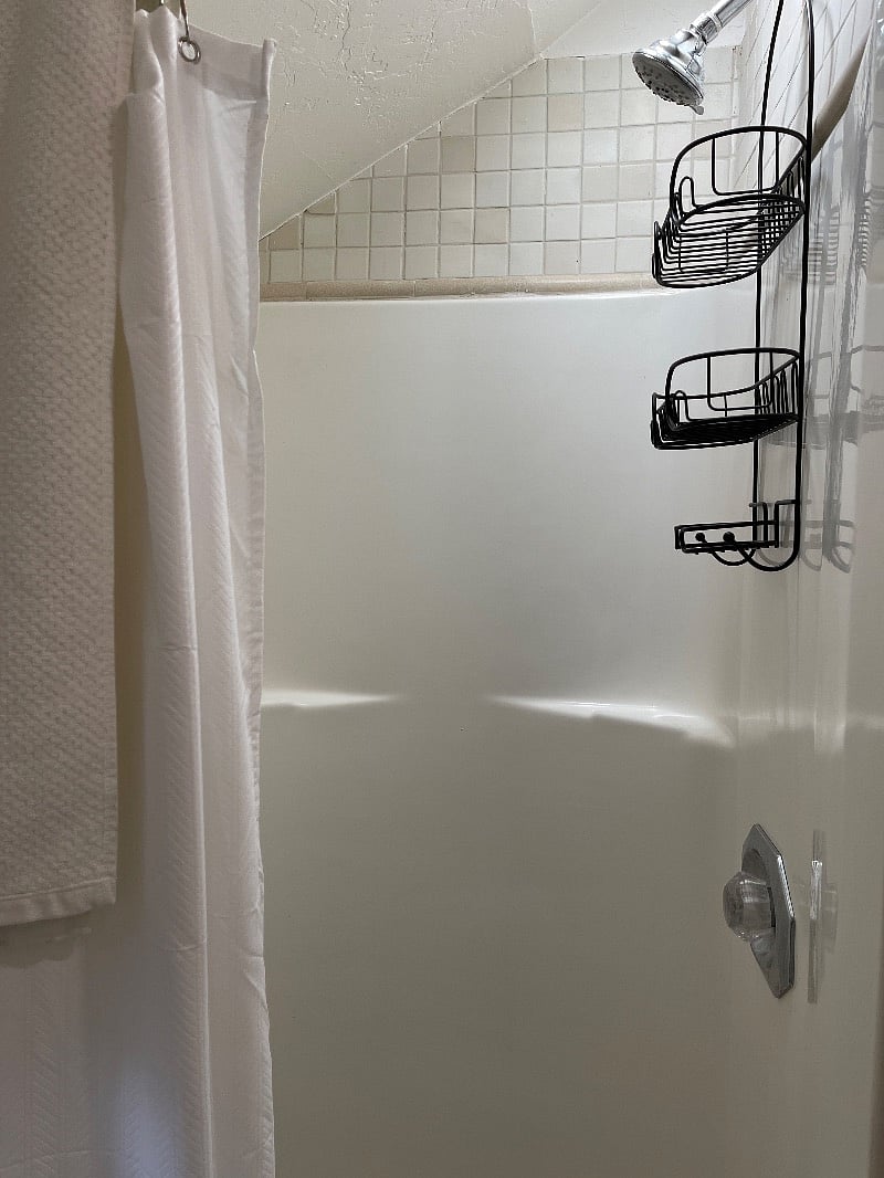 Shower is small but bright and space for your bottles & soaps.  