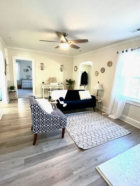 Cozy common space with 55" mounted smart TV above the fireplace
