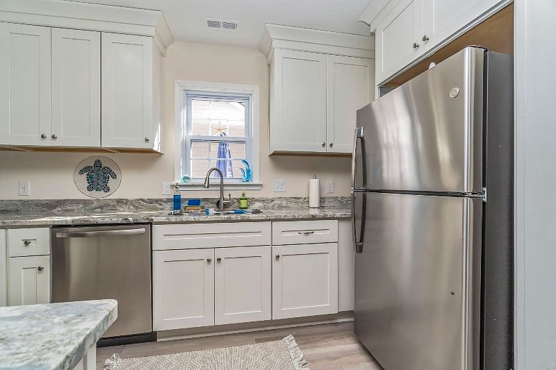 Refrigerator and pantry equipped with starter condiments and kitchen staples.