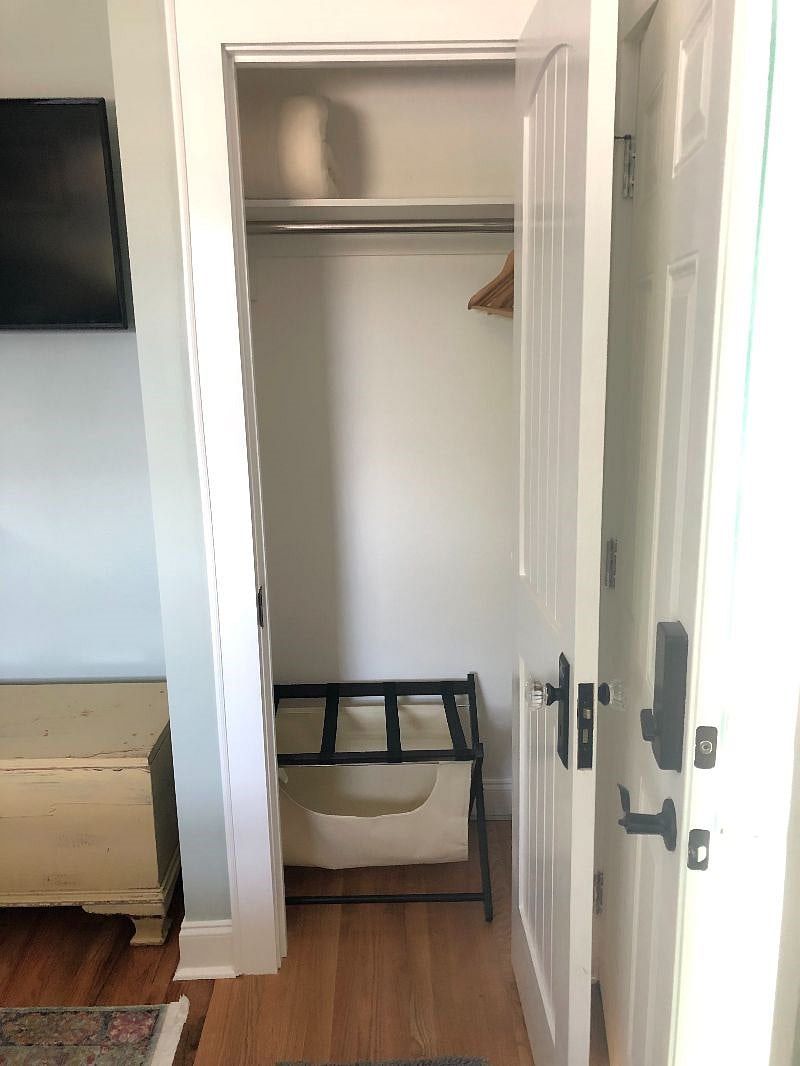 Master bedroom closet with luggage rack/clothes hamper