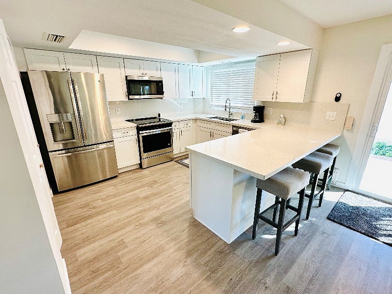 Updated kitchen with 3 stools at the bar. 