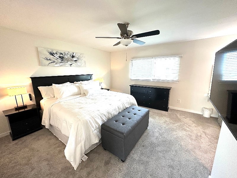 Primary Bedroom with bathroom, makeup vanity, and walk in closet. 