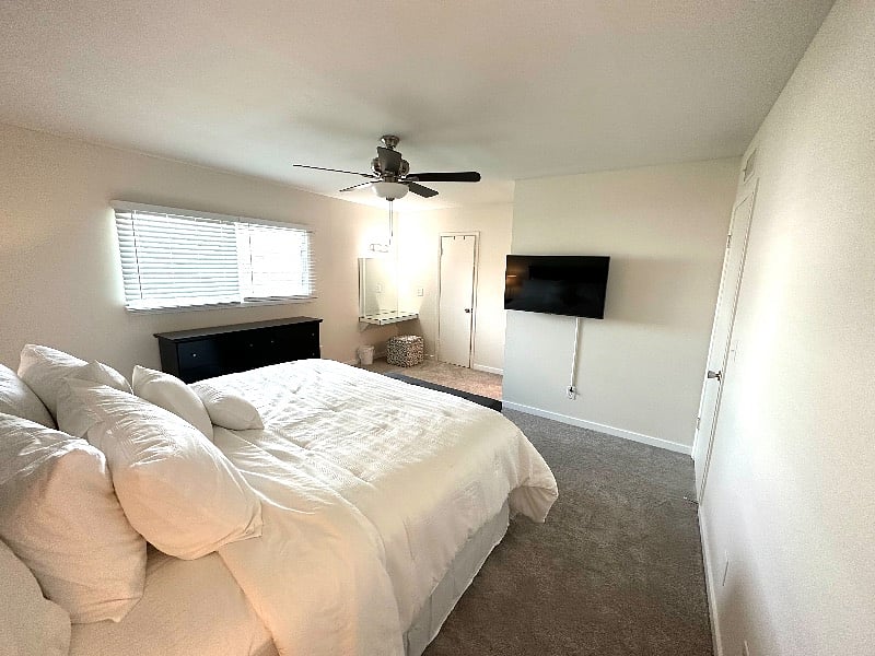 Primary bedroom looking with a great viewl of the makeup vanity and door to the walk in closet