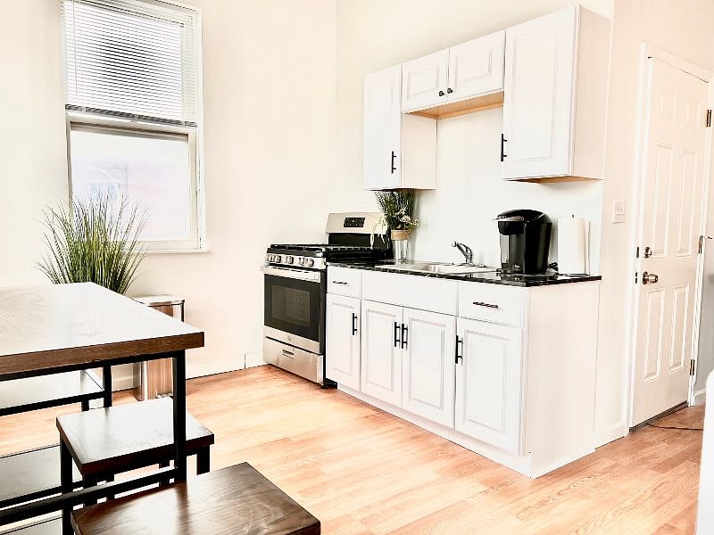 Kitchen with microwave, Kureg coffee maker and upgraded stainless steel gas stove