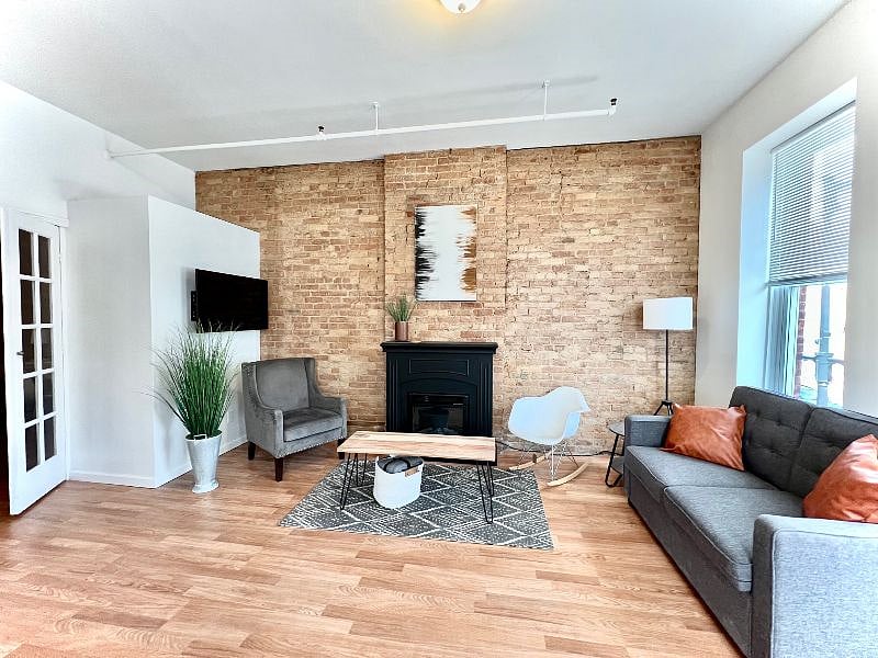 Living room with French doors leading to the bedroom