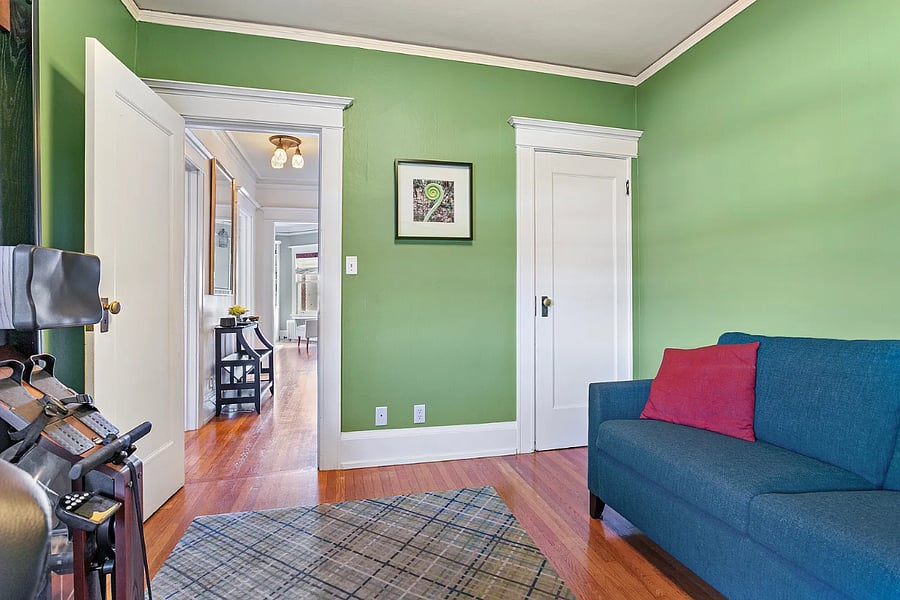 Office/workout room with comfortable sofa bed for guests