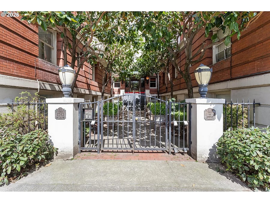 Front gate on NW Johnson, there is also a door via the parking lot and also on NW 21st Ave.