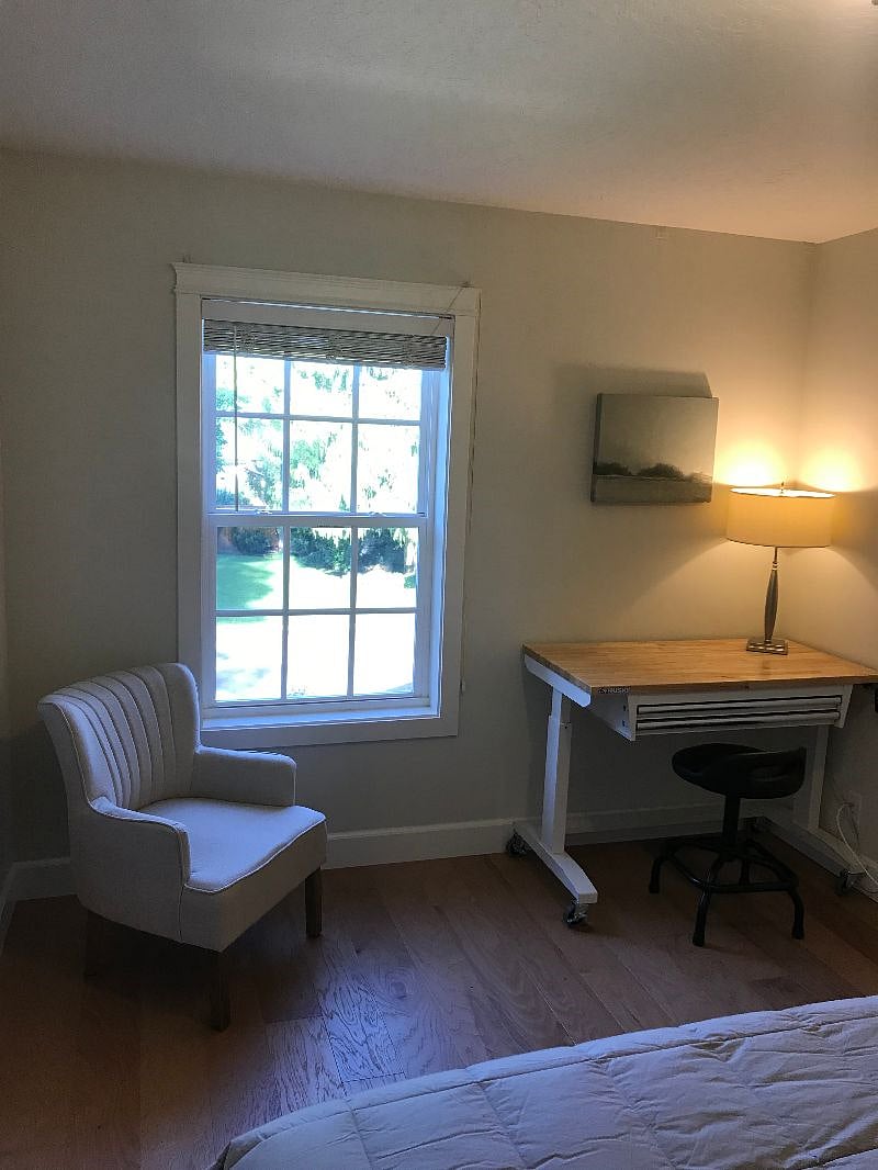 bedroom #1 with adjustable height desk and view window.