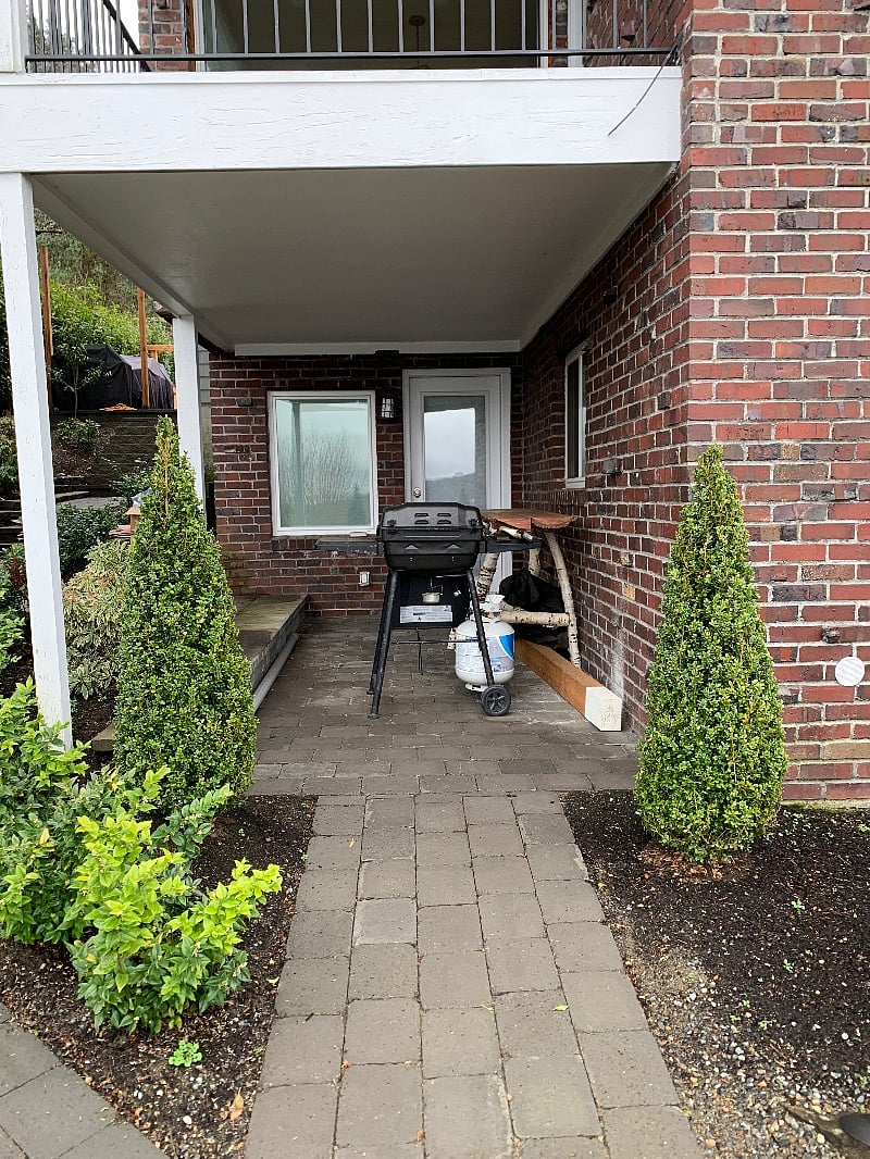 Kitchen door entry with covered patio for barbecuing.