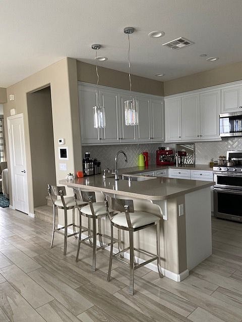 Kitchen is on a 2nd floor.  Specious and gorgeous!  My home was a model for a building company and it was designed by professionals and they made everything upgraded. Kitchen has walk in pantry and large fridge.