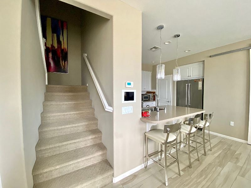 Staircase to a bedroom with its own bathroom on a 3rd floor.