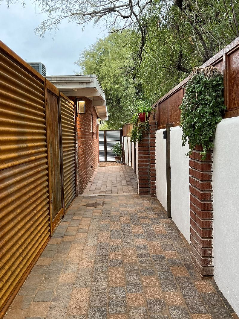 Walkway from the gate to the front door and backyard