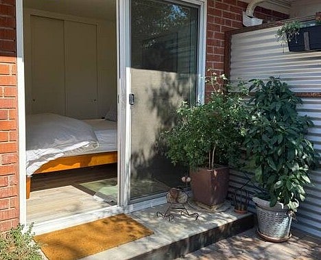 Sliding glass door connects patio to sleeping area