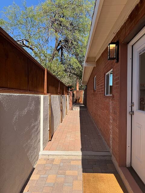 View of the walkway from the front door of the studio to the gate