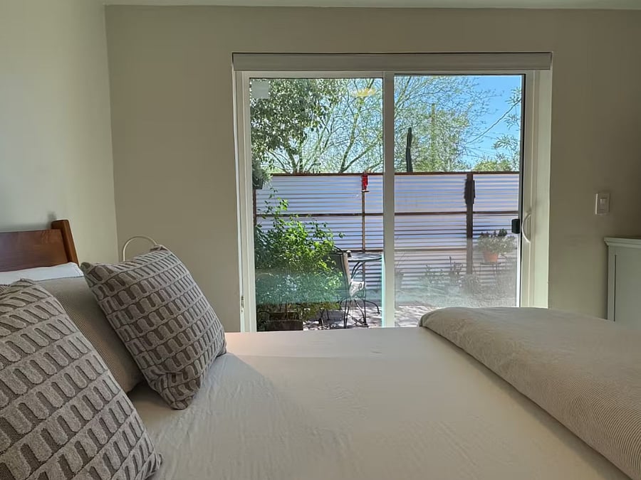 Sliding glass door leads to sitting area on patio