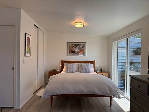 Peaceful sleeping - blackout shades can be pulled down to cover sliding glass door or raised to let in natural light