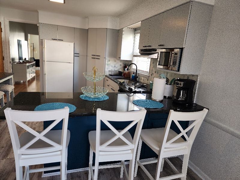 Kitchen Island and view of TV Living Room