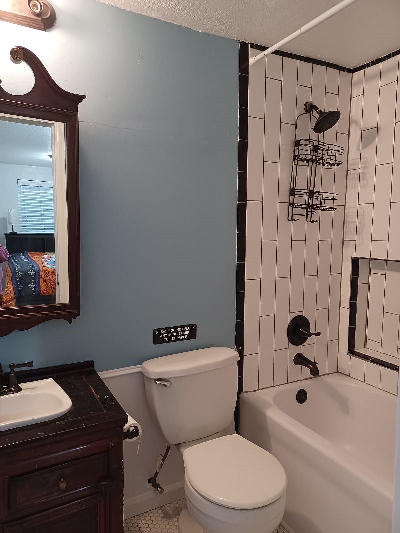 Ensuite bathroom with tub and shower