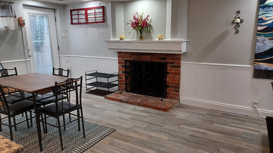 Front door, fire place, and dining room