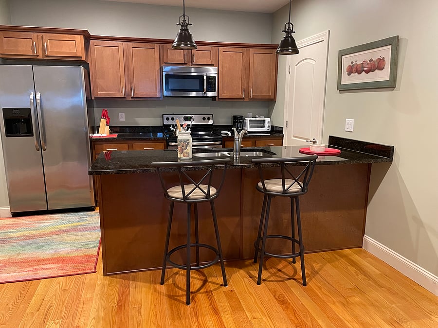 dishwasher, and other stainless steel appliances with granite countertops