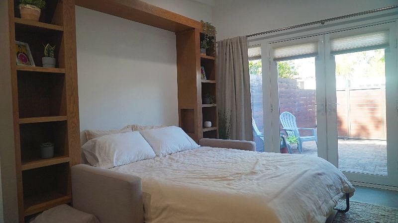 Queen sized murphy bed with comfy mattress.