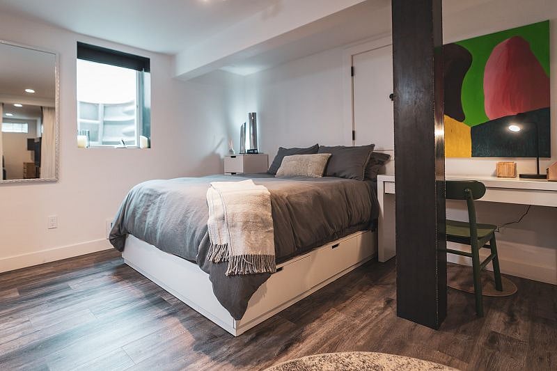 Queen bed and personal desk. Extra storage can be found in bedroom, in addition to ample closet space.